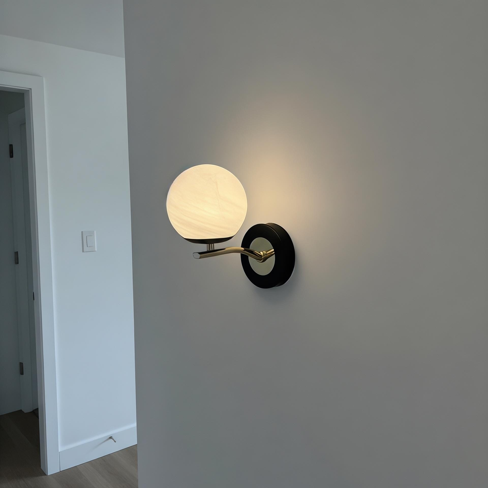 Modern Black and Brass Globe Wall Sconce, Integrated LED Wall Light for Bedroom, Hallway, Living Room, and Bedside